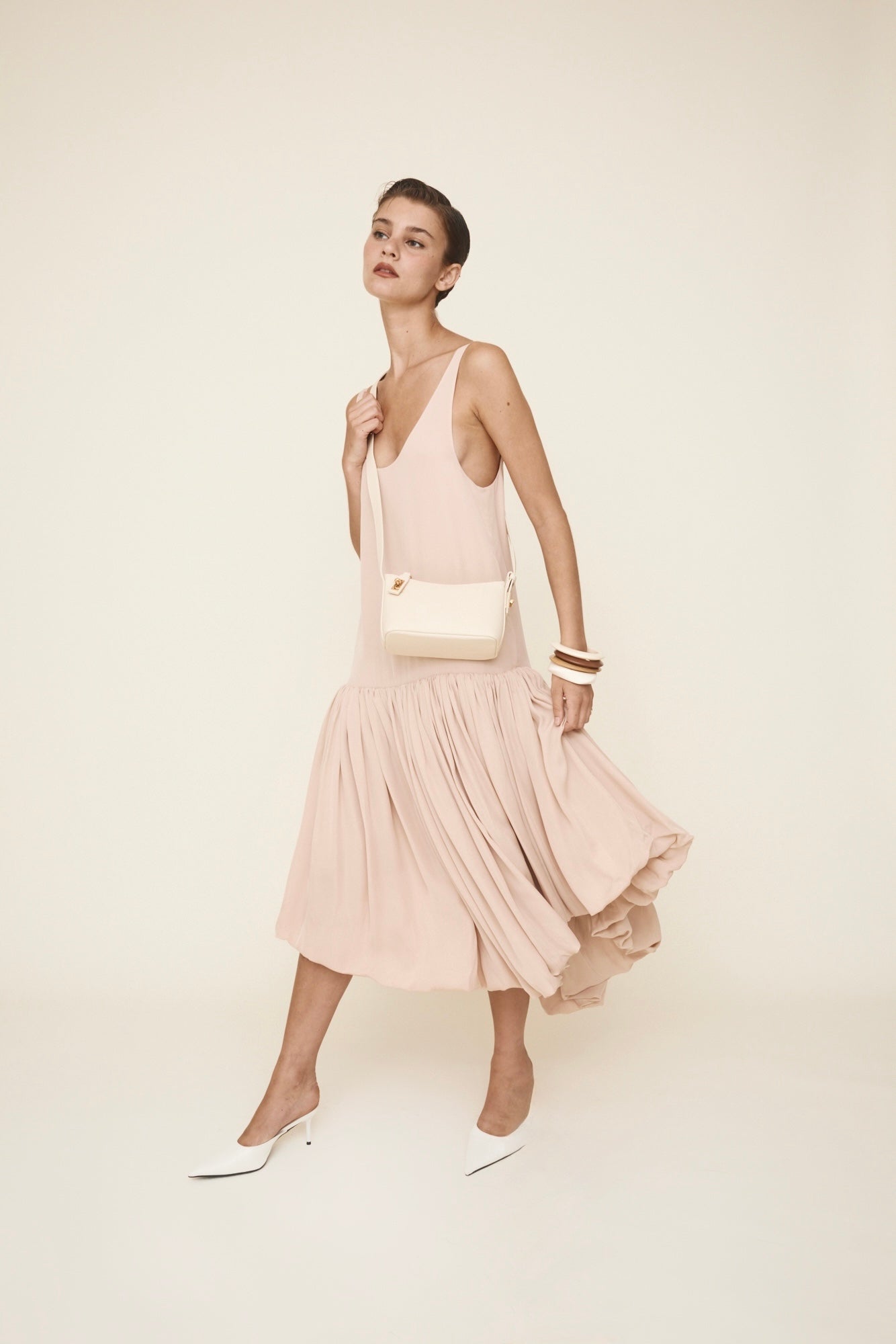 Chic Ivory Togo Leather Twister Hobo Bag with Adjustable Strap Gold Accents