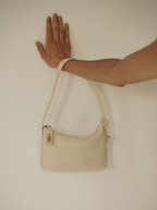Chic Ivory Togo Leather Twister Hobo Bag with Adjustable Strap Gold Accents