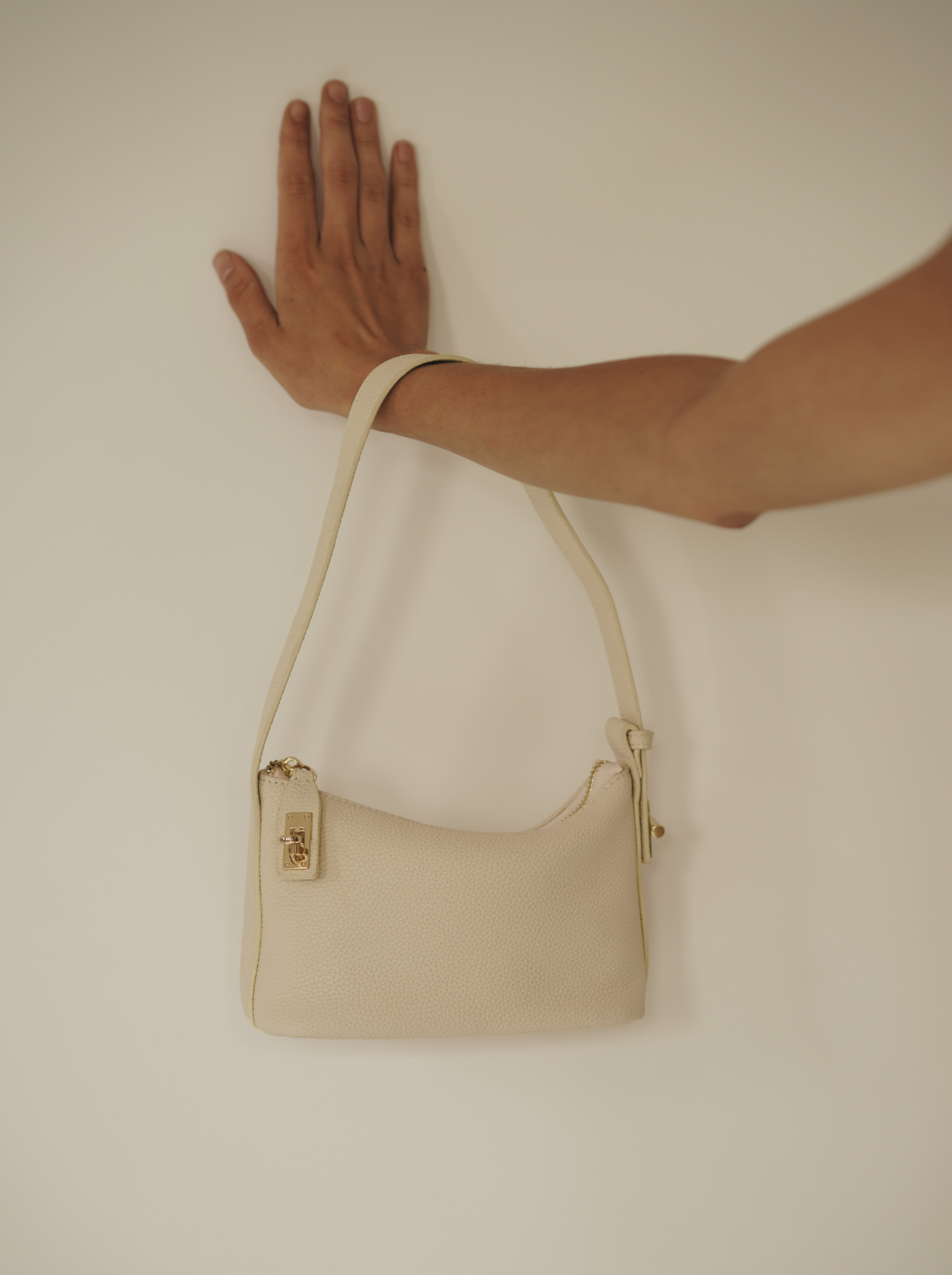 Chic Ivory Togo Leather Twister Hobo Bag with Adjustable Strap Gold Accents