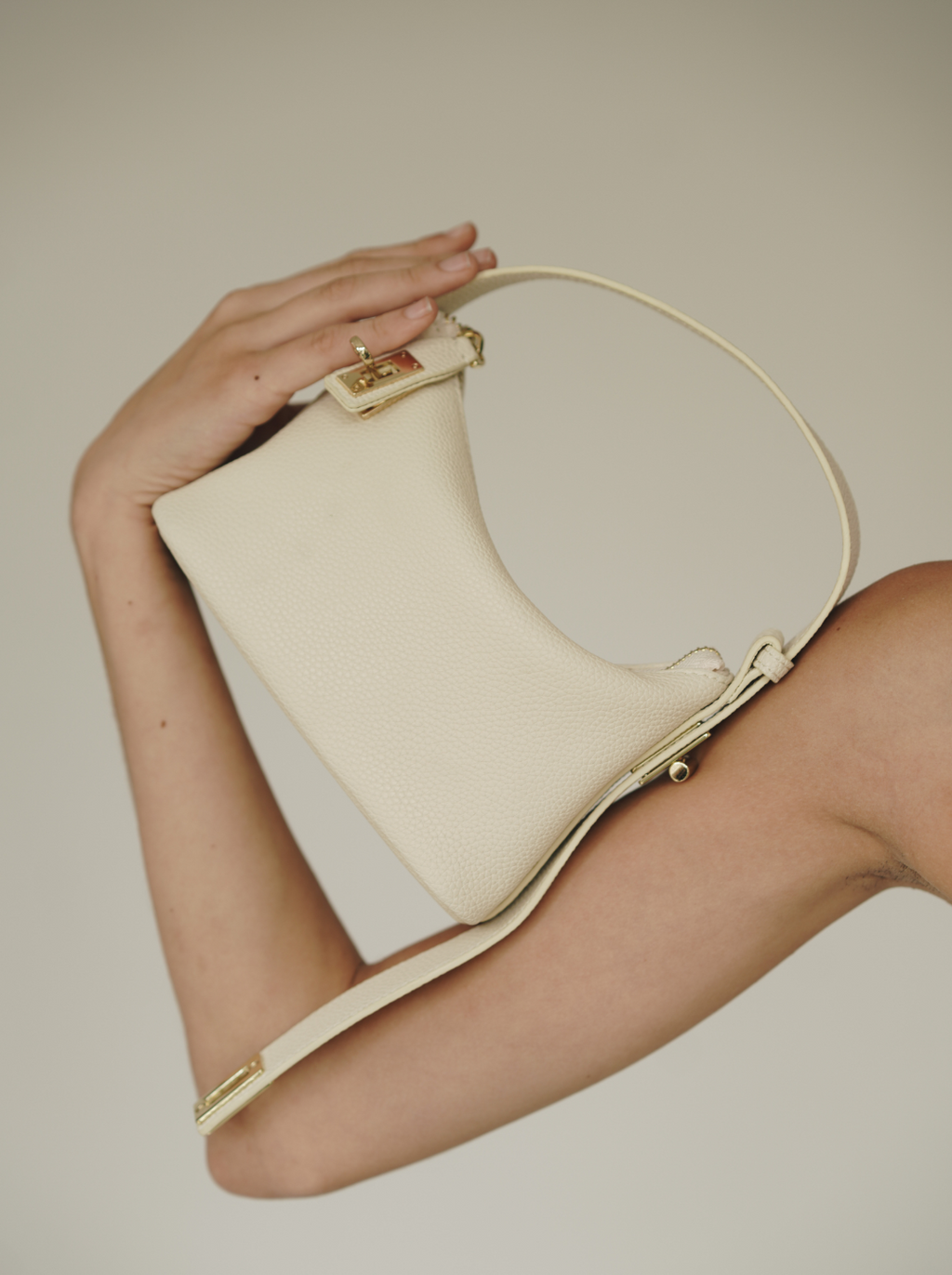 Chic Ivory Togo Leather Twister Hobo Bag with Adjustable Strap Gold Accents