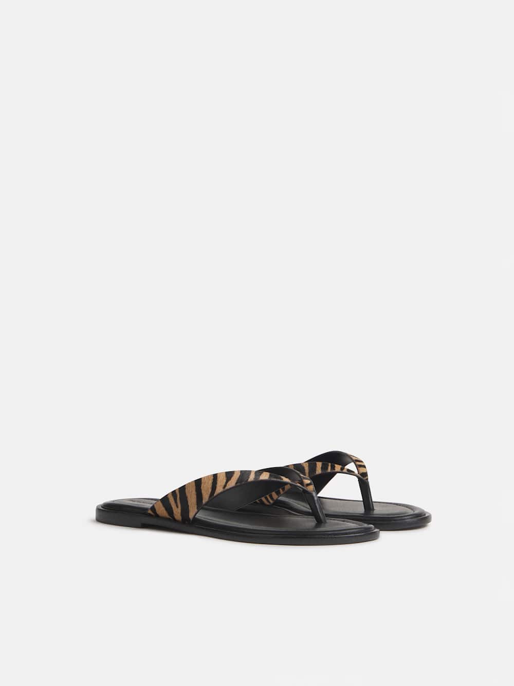 https://media.thereformation.com/image/upload/f_auto,q_auto:eco,dpr_2.0/w_500/PRD-SFCC/1315665/WARM_TIGER_HAIRCALF/1315665.4.WARM_TIGER_HAIRCALF