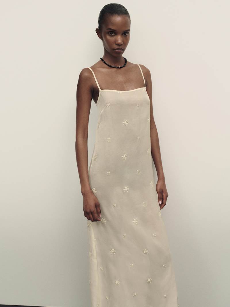 https://media.thereformation.com/image/upload/f_auto,q_auto,dpr_1.0/w_800,c_scale//PRD-SFCC/1319870/IVORY_EMBELLISHED/1319870.1.IVORY_EMBELLISHED?_s=RAABAB0