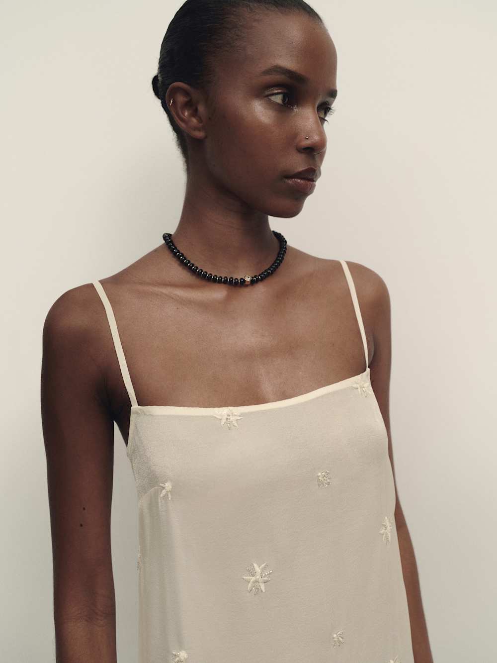 https://media.thereformation.com/image/upload/f_auto,q_auto:eco,dpr_2.0/w_500/PRD-SFCC/1319870/IVORY_EMBELLISHED/1319870.4.IVORY_EMBELLISHED
