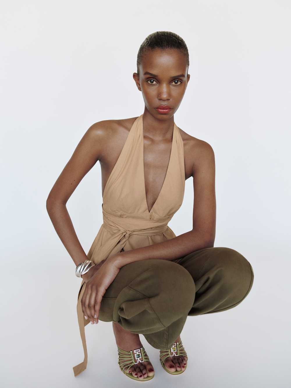 https://media.thereformation.com/image/upload/f_auto,q_auto:eco,dpr_2.0/w_500/PRD-SFCC/1320029/TRENCH_COAT/1320029.4.TRENCH_COAT