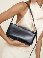 Chic Genuine Leather Black Shoulder Bag with Golden Hardware - Compact Baguette Style
