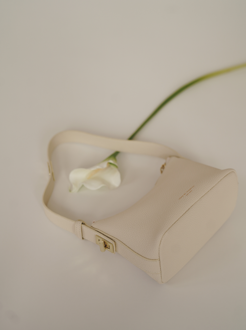 Chic Ivory Togo Leather Twister Hobo Bag with Adjustable Strap Gold Accents