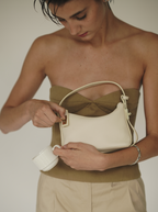 Chic Ivory Togo Leather Twister Hobo Bag with Adjustable Strap Gold Accents