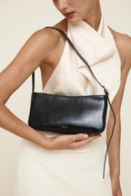 Chic Genuine Leather Black Shoulder Bag with Golden Hardware - Compact Baguette Style