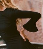 Elegant Black '60s Inspired Merino Wool Tiered Mini Dress with Ruffle Cuffs