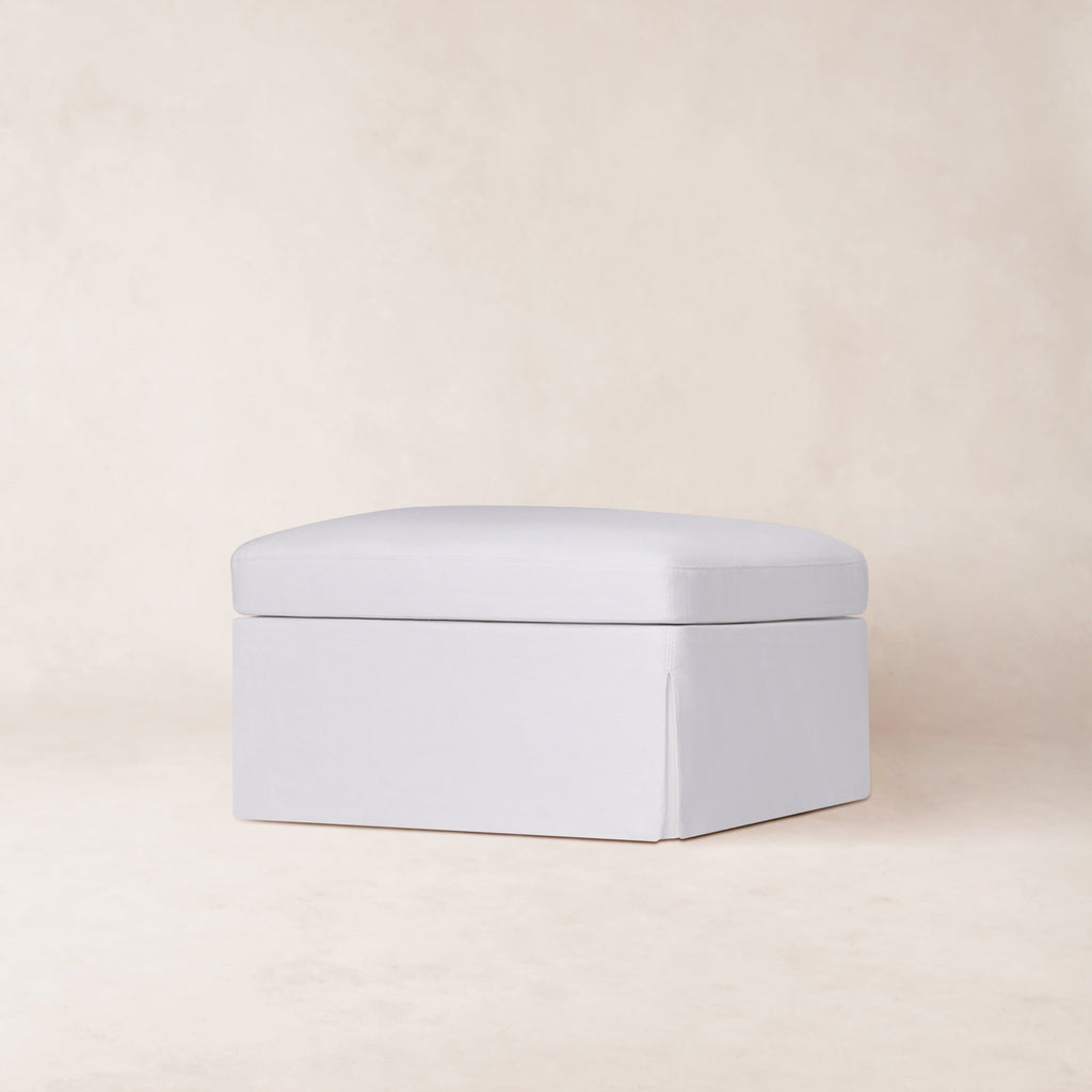 https://cdn.shopify.com/s/files/1/0593/2217/1565/files/Antwerp-Ottoman-3_4-Linen-White.jpg?v=1772665036