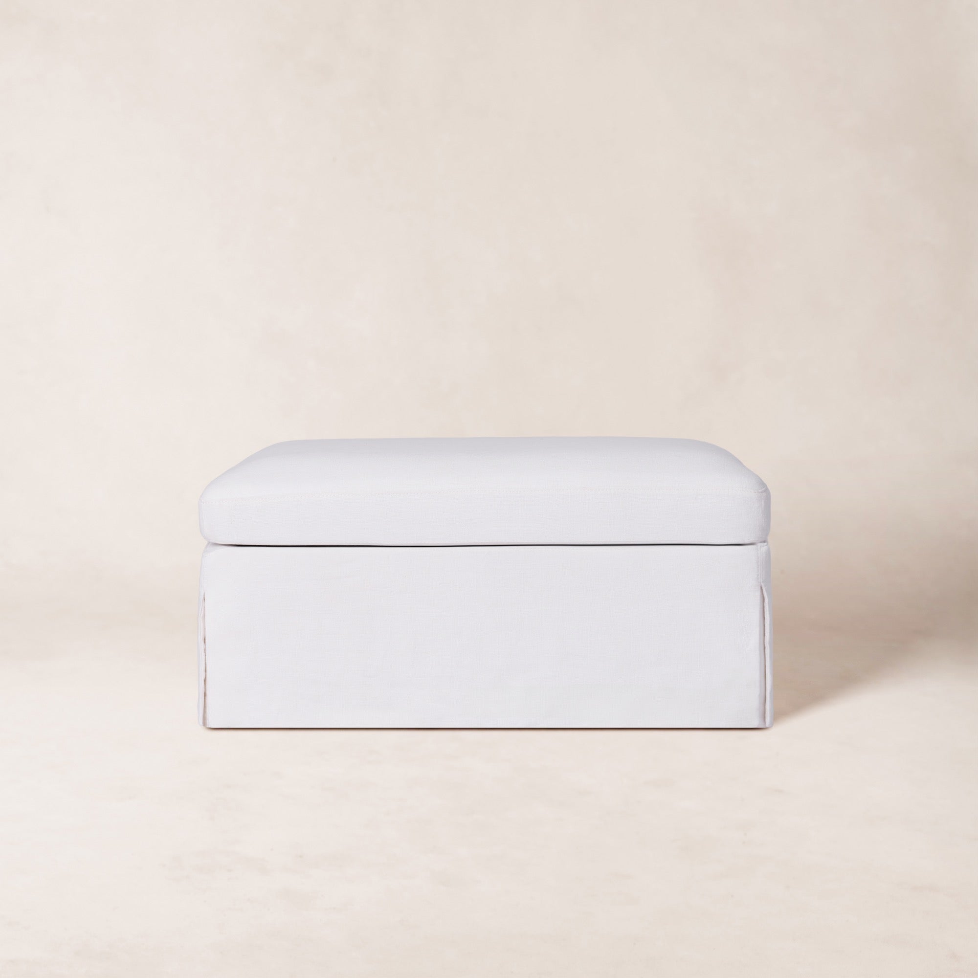 https://cdn.shopify.com/s/files/1/0593/2217/1565/files/Antwerp-Ottoman-Front-Linen-White.jpg?v=1772665036