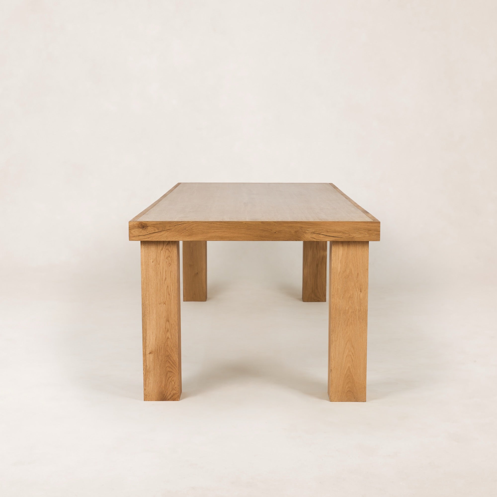 https://cdn.shopify.com/s/files/1/0593/2217/1565/files/Antwerp_DiningTable_Side_100_SolidOak_FrenchOak_BeigeTravertine.jpg?v=1772742629