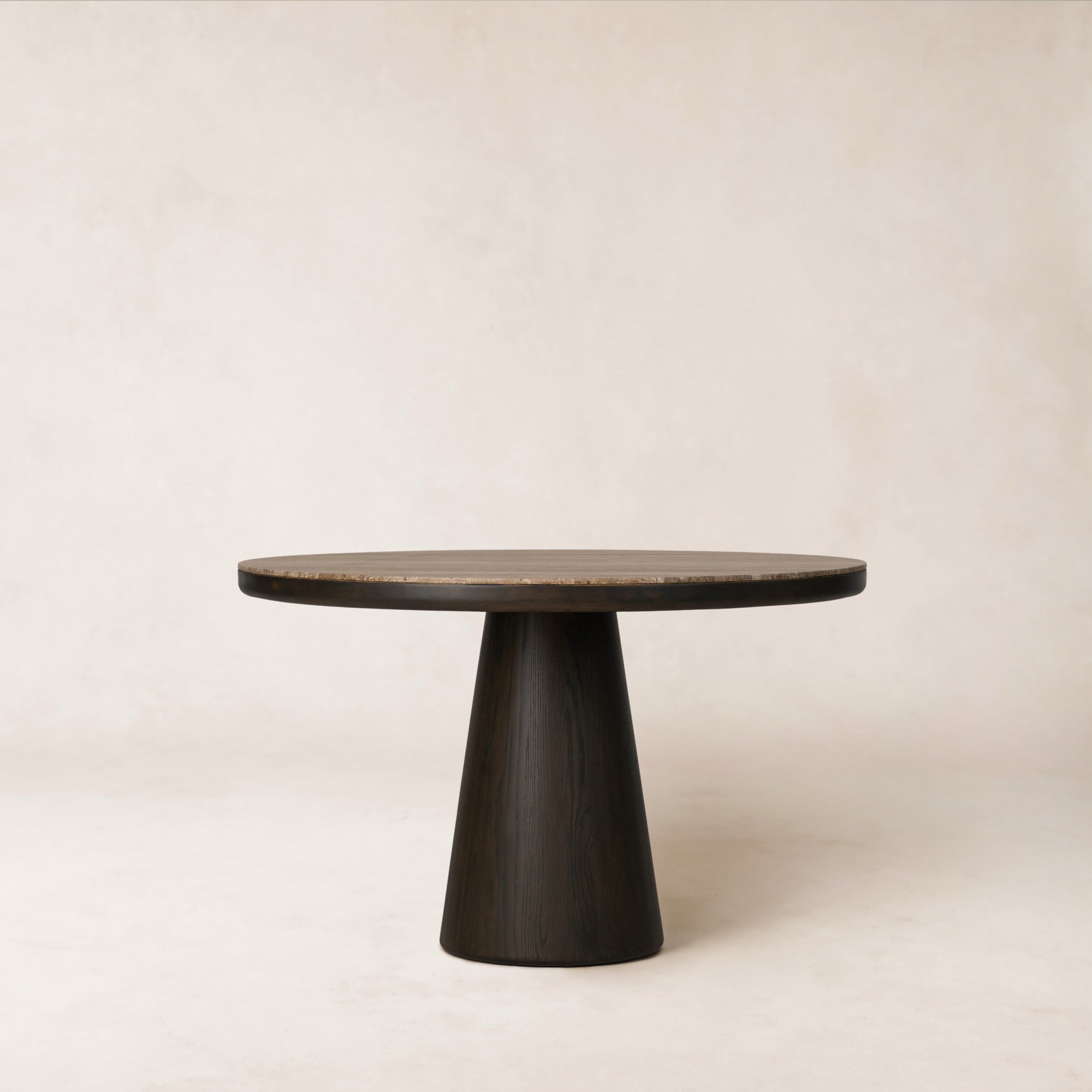 https://cdn.shopify.com/s/files/1/0593/2217/1565/files/Eik_DiningTable_48_Front_SolidOak_Watercolorblk_BlkTravertine.jpg?v=1772580641
