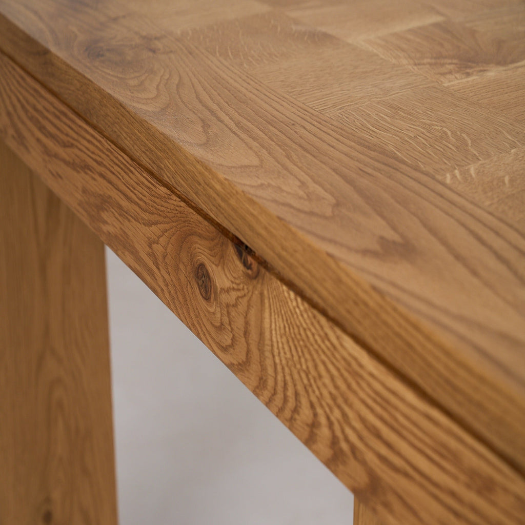 https://cdn.shopify.com/s/files/1/0593/2217/1565/files/Ghent_DiningTable_Parquet_SideDetail_SolidOak_FrenchOak.jpg?v=1772823104
