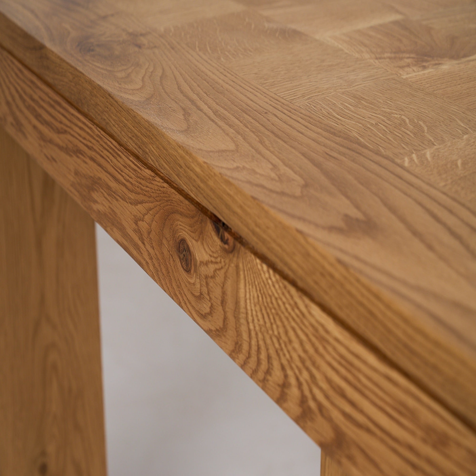 https://cdn.shopify.com/s/files/1/0593/2217/1565/files/Ghent_DiningTable_Parquet_SideDetail_SolidOak_FrenchOak.jpg?v=1772823104