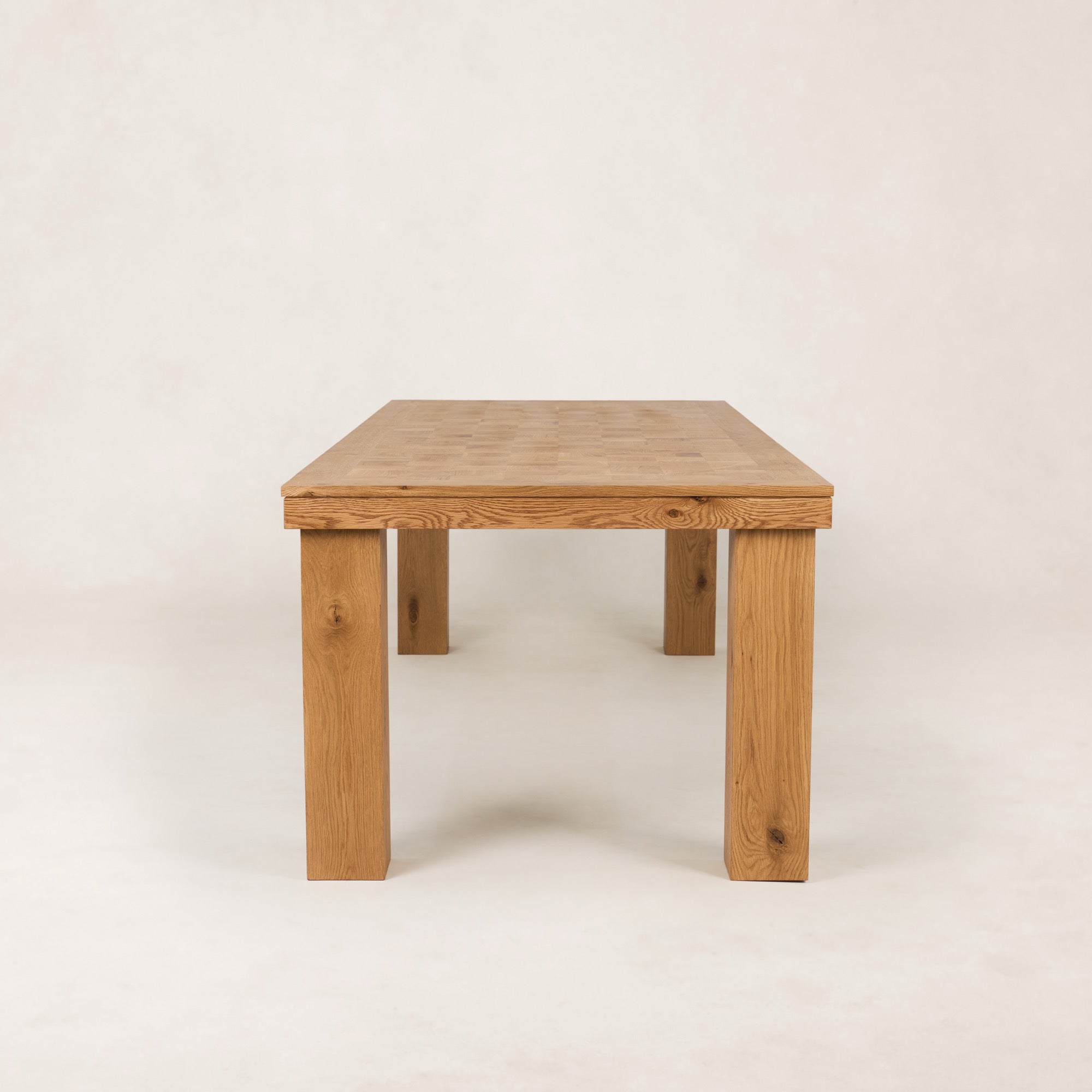 https://cdn.shopify.com/s/files/1/0593/2217/1565/files/Ghent_Dining_Table_1oo_Side_Parquet__Detail_Solid_Oak_French_Oak.jpg?v=1772823104
