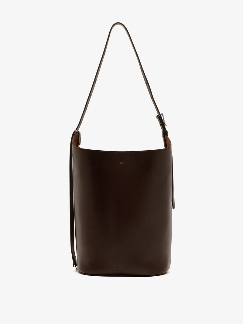 https://cdn.shopify.com/s/files/1/0027/1699/1534/files/HB252085-C404S-206_Brant_20Bucket_20Bag_20in_20Smooth_20Calf_Chocolate_V1.jpg?v=1752721368