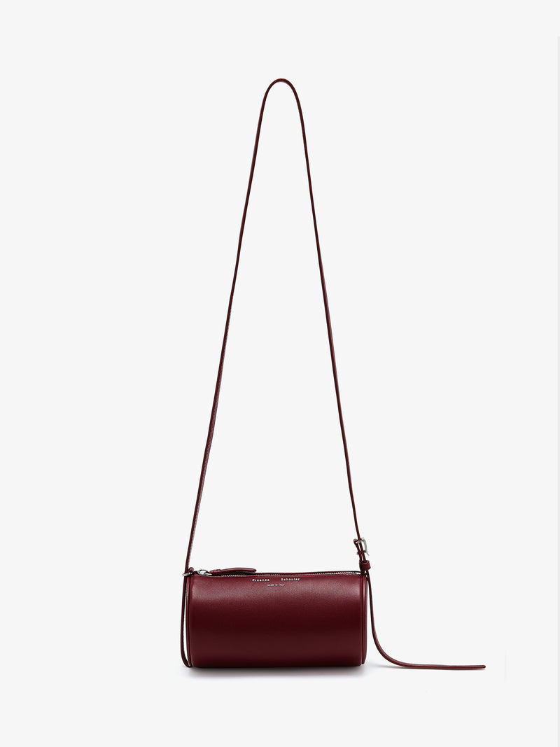 https://cdn.shopify.com/s/files/1/0027/1699/1534/files/HB253099-L014S-641_Crossbody_20Silo_20Bag_Merlot_V0.jpg?v=1744912522