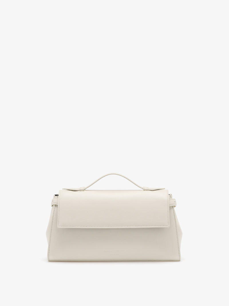 https://cdn.shopify.com/s/files/1/0027/1699/1534/files/HB261118-C327P-112_Tate_20Clutch_20with_20Strap_20in_20Smooth_20Calf_Soft_20White_V1.jpg?v=1760923583