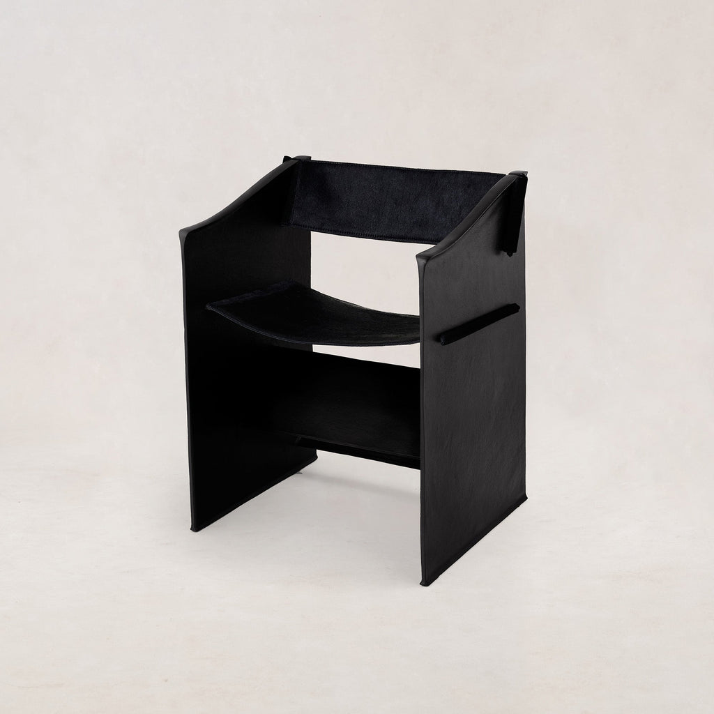 https://cdn.shopify.com/s/files/1/0593/2217/1565/files/Ingress-Dining-Chair-Hair-on-Hide-Black-1.jpg?v=1764709119
