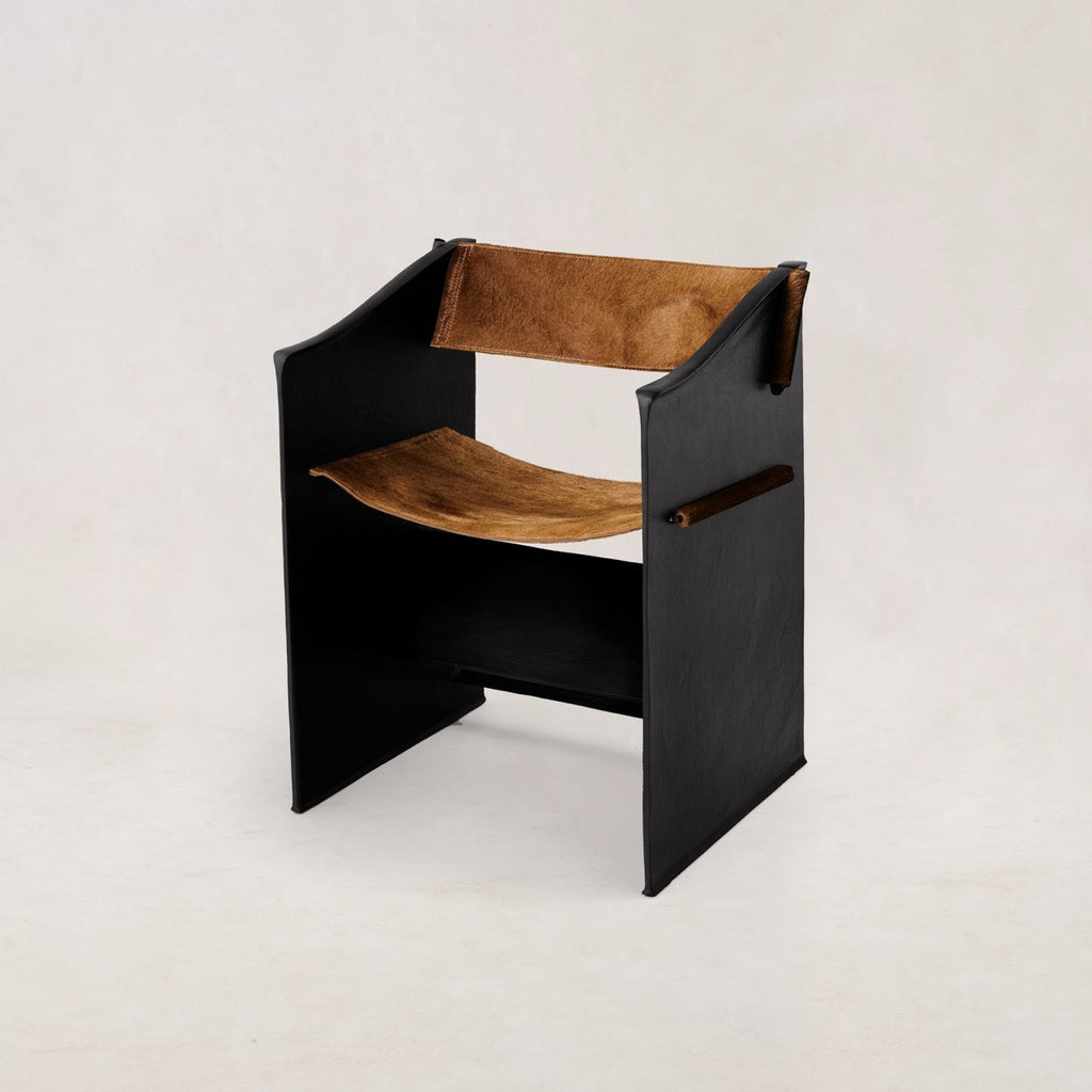https://cdn.shopify.com/s/files/1/0593/2217/1565/files/Ingress-Dining-Chair-Hair-on-Hide-Whiskey-1.jpg?v=1762799537