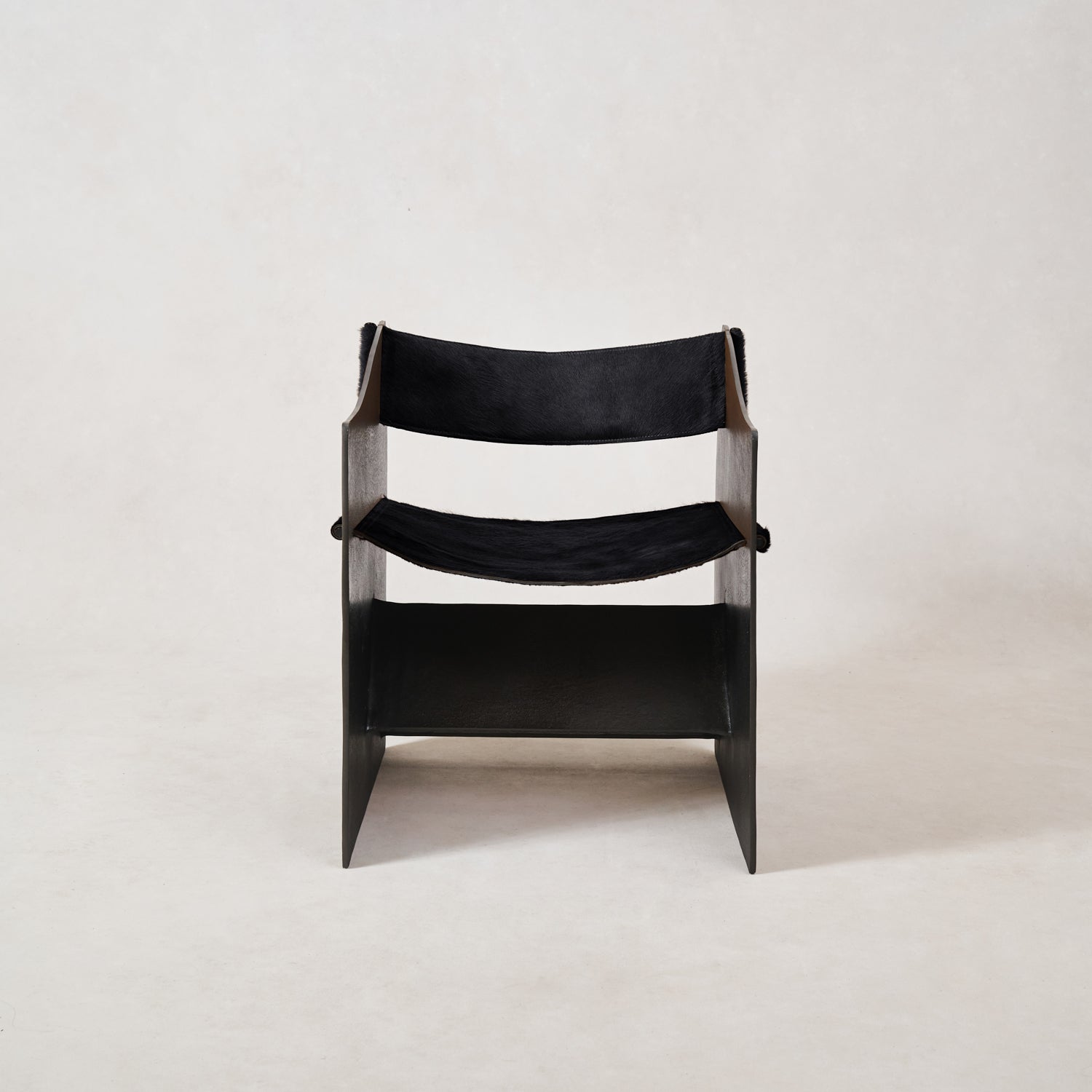 https://cdn.shopify.com/s/files/1/0593/2217/1565/files/Ingresso-Accent-Chair-Black-Hair-On-Hide-1.jpg?v=1753822707