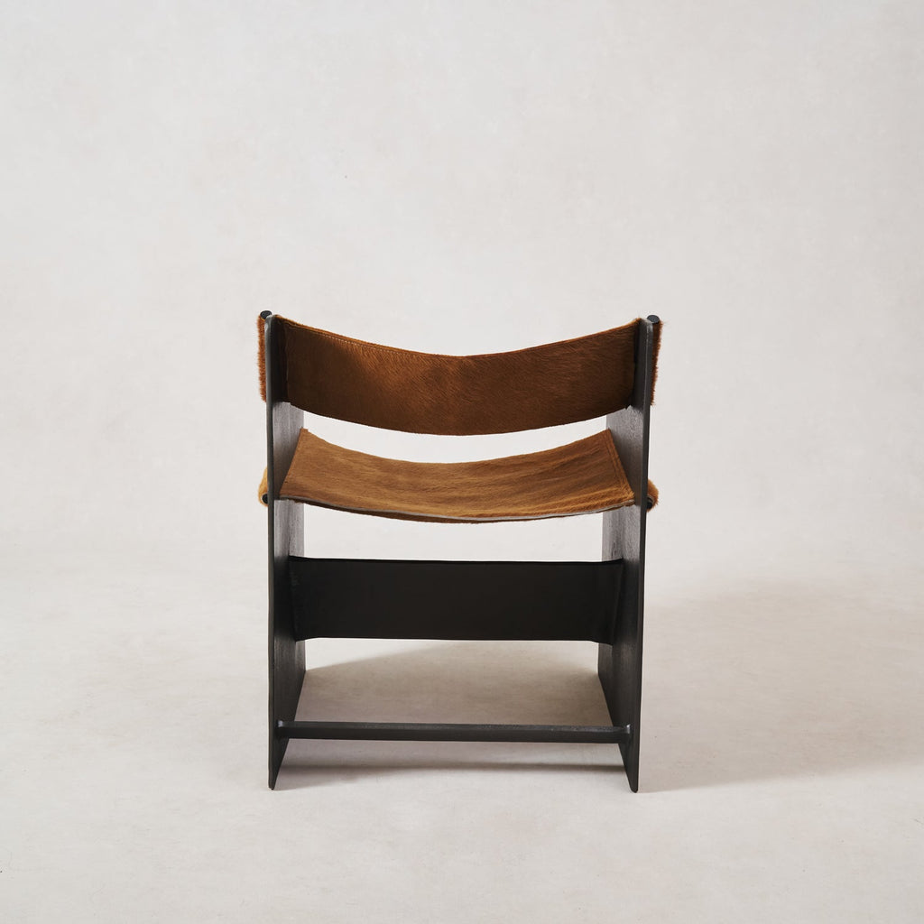 https://cdn.shopify.com/s/files/1/0593/2217/1565/files/Ingresso-Accent-Chair-Whiskey-Hair-on-Hyde-4.jpg?v=1753822707