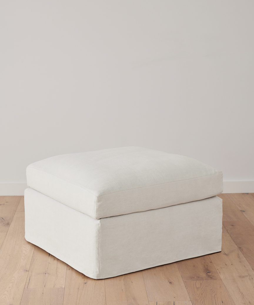 https://cdn.shopify.com/s/files/1/0565/1234/8333/products/JenniKayne_HarborOttoman_IvoryLinen-1.jpg?v=1762182573