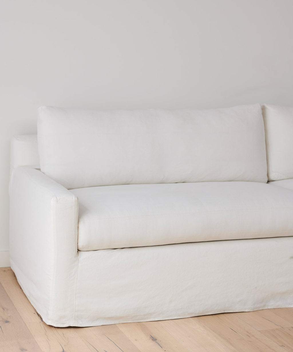 https://cdn.shopify.com/s/files/1/0565/1234/8333/products/JenniKayne_HarborSofa_Ivory-02.jpg?v=1681774386