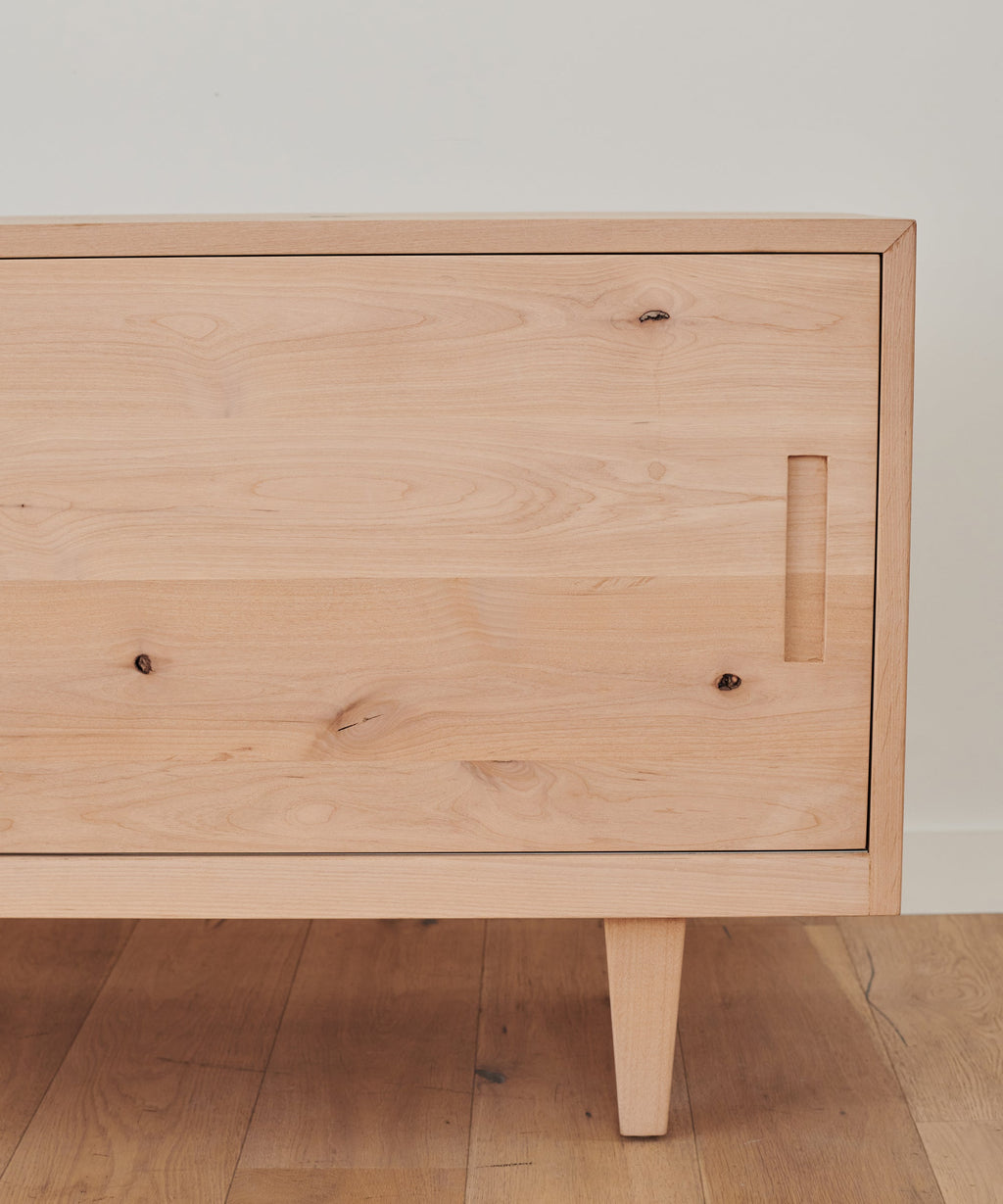 https://cdn.shopify.com/s/files/1/0565/1234/8333/products/JenniKayne_MandevilleCredenza_KnottyAlder-3.jpg?v=1642531895