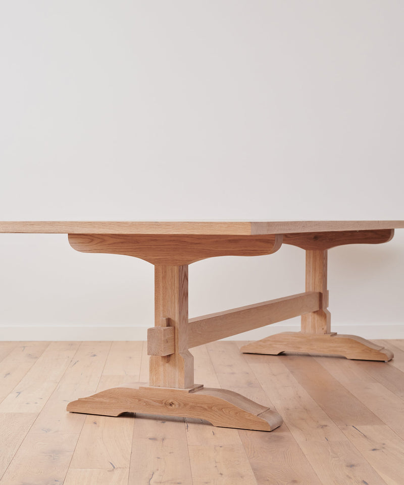 https://cdn.shopify.com/s/files/1/0565/1234/8333/products/JenniKayne_TrestleDiningTable_Oak-01.jpg?v=1762182598