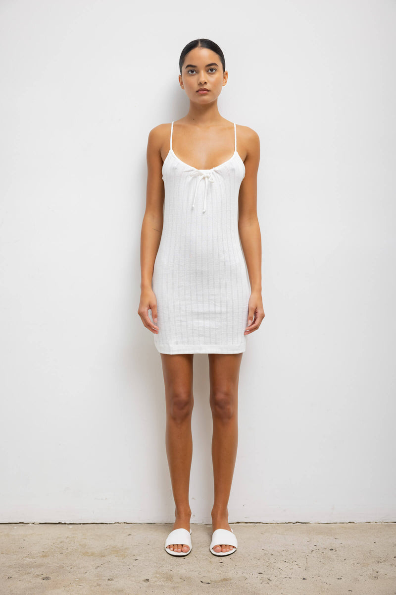 https://cdn.shopify.com/s/files/1/1286/8573/files/LESET_POINTELLE_POINTELLETIEFRONTDRESS_WHITE_ONMODEL_1.jpg?v=1731101445