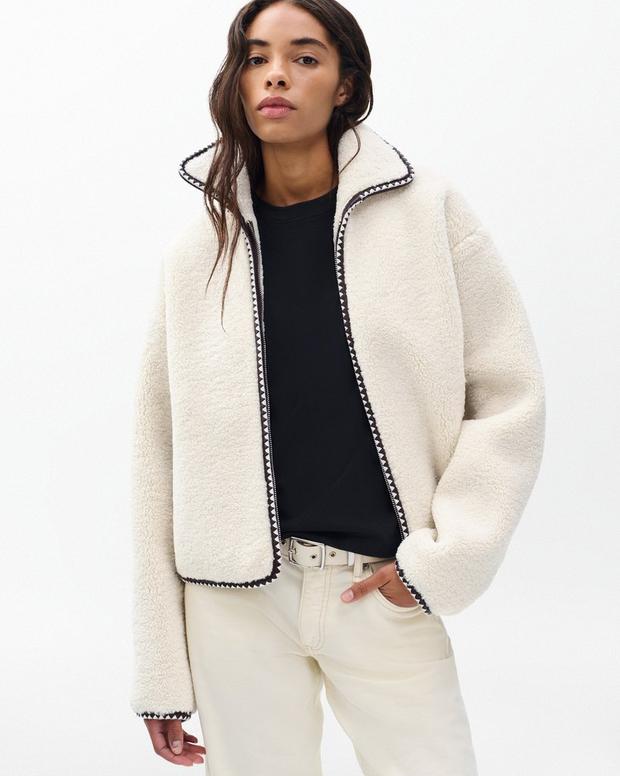 Cozy Ivory Sherpa Zip-Up Jacket: Plush Bomber Fit, Faux-Leather Trim, Ultimate Comfort