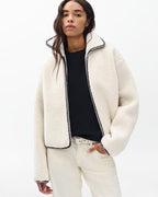 Cozy Ivory Sherpa Zip-Up Jacket: Plush Bomber Fit, Faux-Leather Trim, Ultimate Comfort