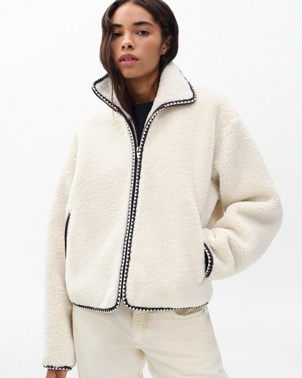 Cozy Ivory Sherpa Zip-Up Jacket: Plush Bomber Fit, Faux-Leather Trim, Ultimate Comfort