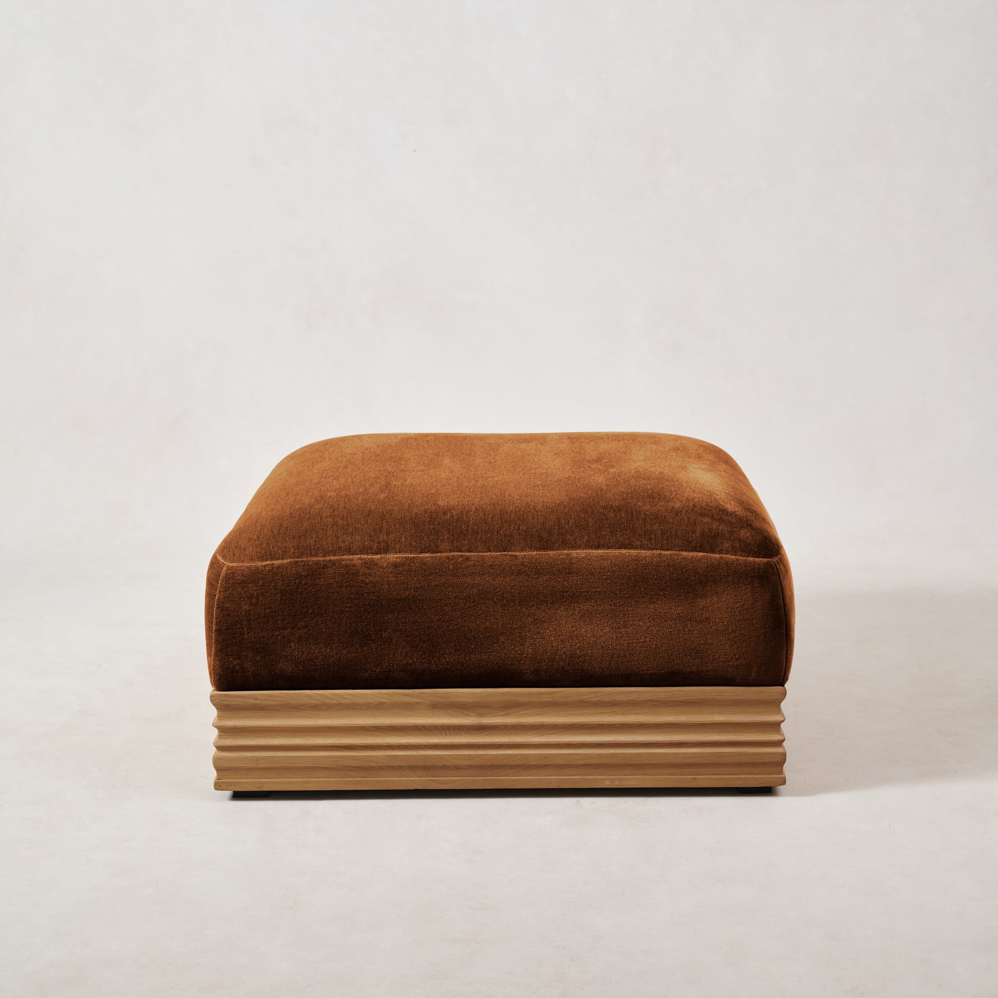 https://cdn.shopify.com/s/files/1/0593/2217/1565/files/Palazzo-Mohair-Wood-Base-Ottoman-Ambra-1.jpg?v=1740460617