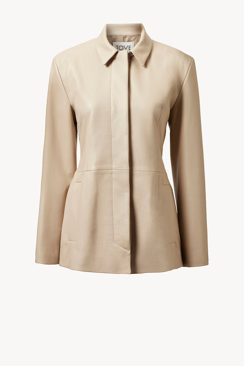 https://cdn.shopify.com/s/files/1/0155/8868/7920/files/Sana_Leather_Coat_Natural_Tove.jpg?v=1731947128