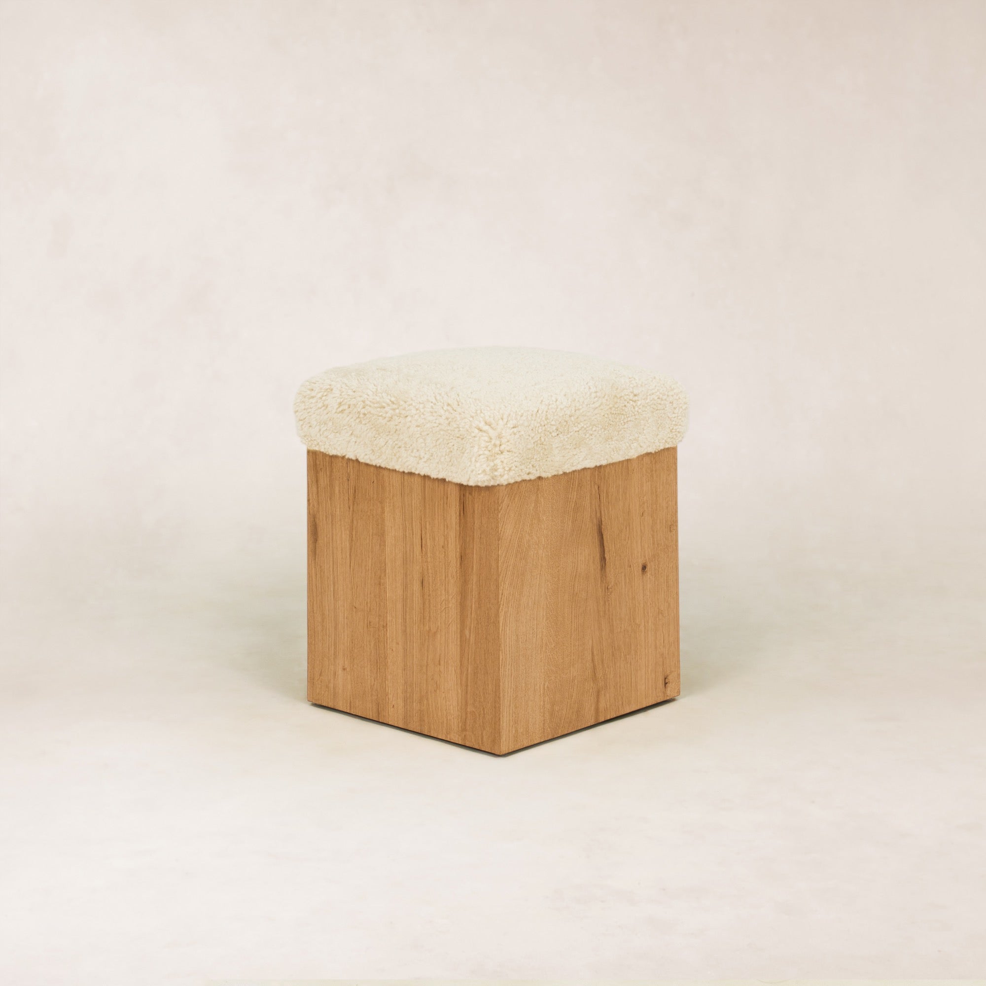 https://cdn.shopify.com/s/files/1/0593/2217/1565/files/SherpaOttomanStool_3_4Top_SolidOak_Shearling.jpg?v=1772496999