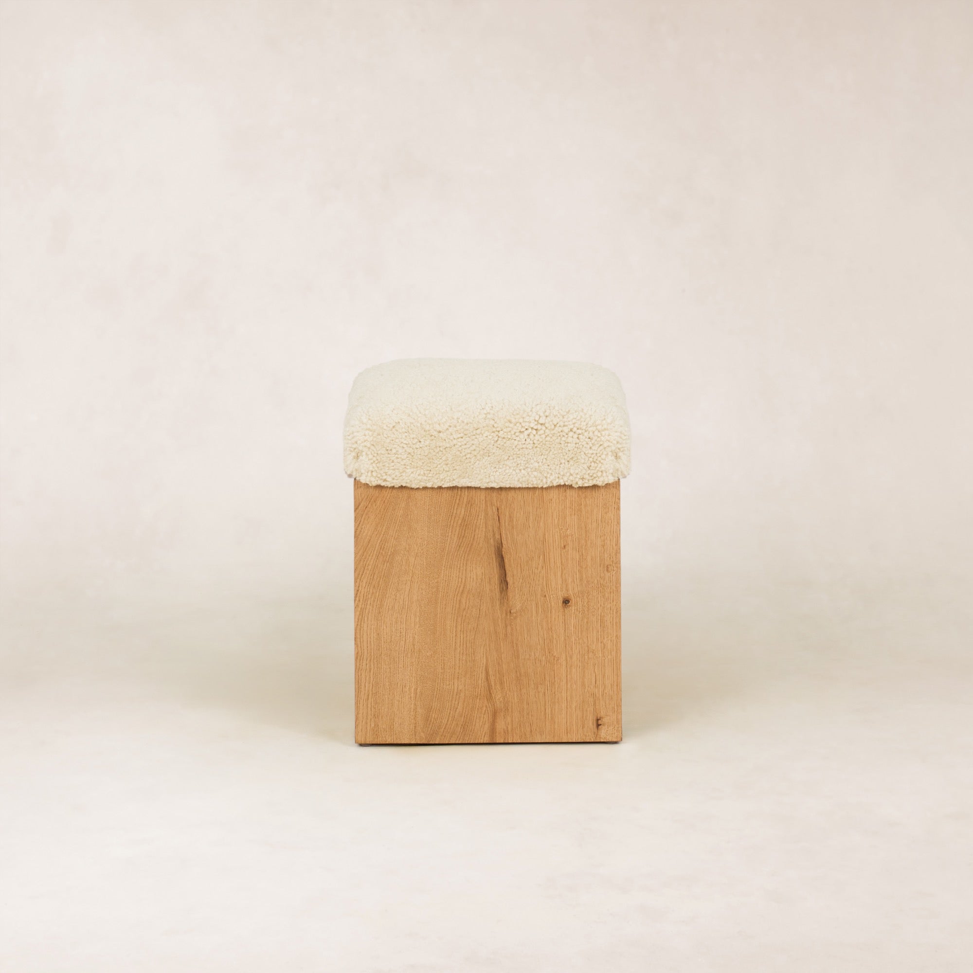 https://cdn.shopify.com/s/files/1/0593/2217/1565/files/SherpaOttomanStool_Side_SolidOak_Shearling.jpg?v=1772587104