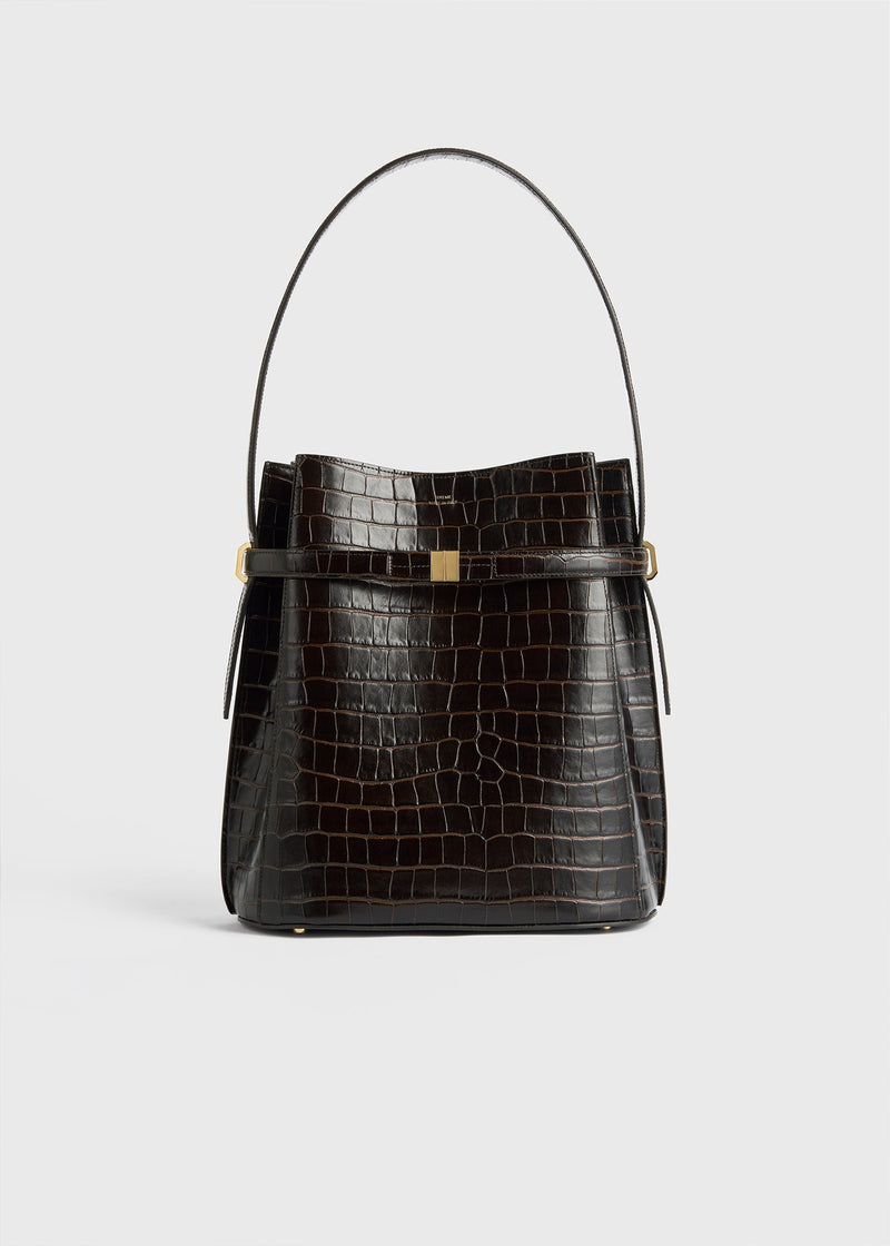 https://cdn.shopify.com/s/files/1/0452/1374/5316/files/TOTEME_FLATS_FW24_BAGS_244-WAL0050-LE0023_CINCHED_TOTE_DARK_BROWN_CROCO_front_GB.jpg?v=1721744364