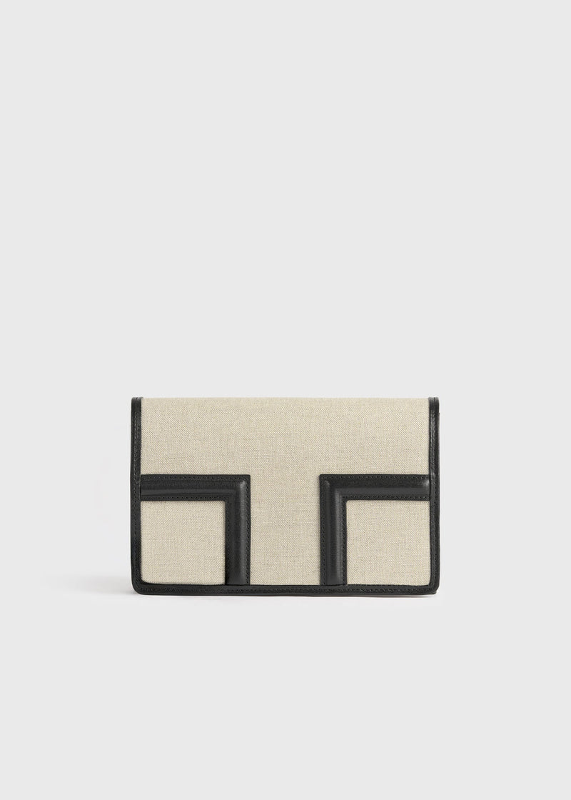 https://cdn.shopify.com/s/files/1/0452/1374/5316/files/TOTEME_FLATS_PF25_TRAVEL_GARDEROB_BAGS_253-WAL0086-FB0234-116_T-FLAP_ENVELOPE_CANVAS_front_V2_GB.jpg?v=1744812167