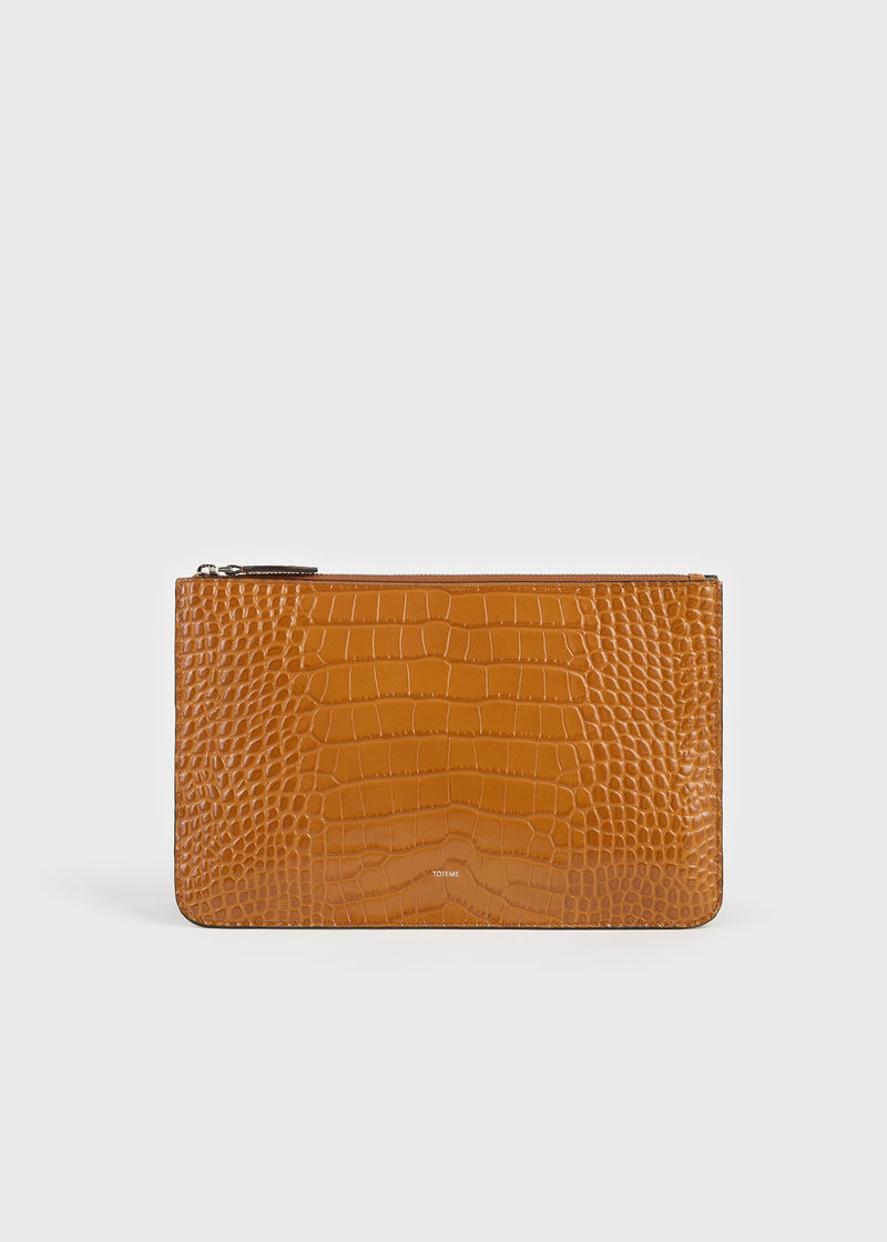 https://cdn.shopify.com/s/files/1/0452/1374/5316/files/TOTEME_FLATS_SS26_SEASONAL_BAGS_262-WAL0122-LE0076-366_THREEFOLD_CROCO_EMBOSSED_CLUTCH_TANGERINE_front_GB.jpg?v=1768823815
