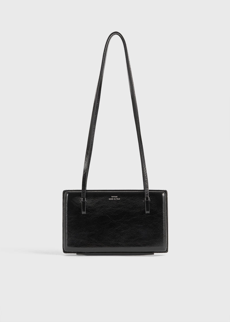 https://cdn.shopify.com/s/files/1/0452/1374/5316/files/TOTEME_FLATS__PS26_SEASONAL_BAGS_261-WAL0111-LE0020-001_COCKTAIL_NAPLACK_BAG_BLACK_front_GB.jpg?v=1760599686