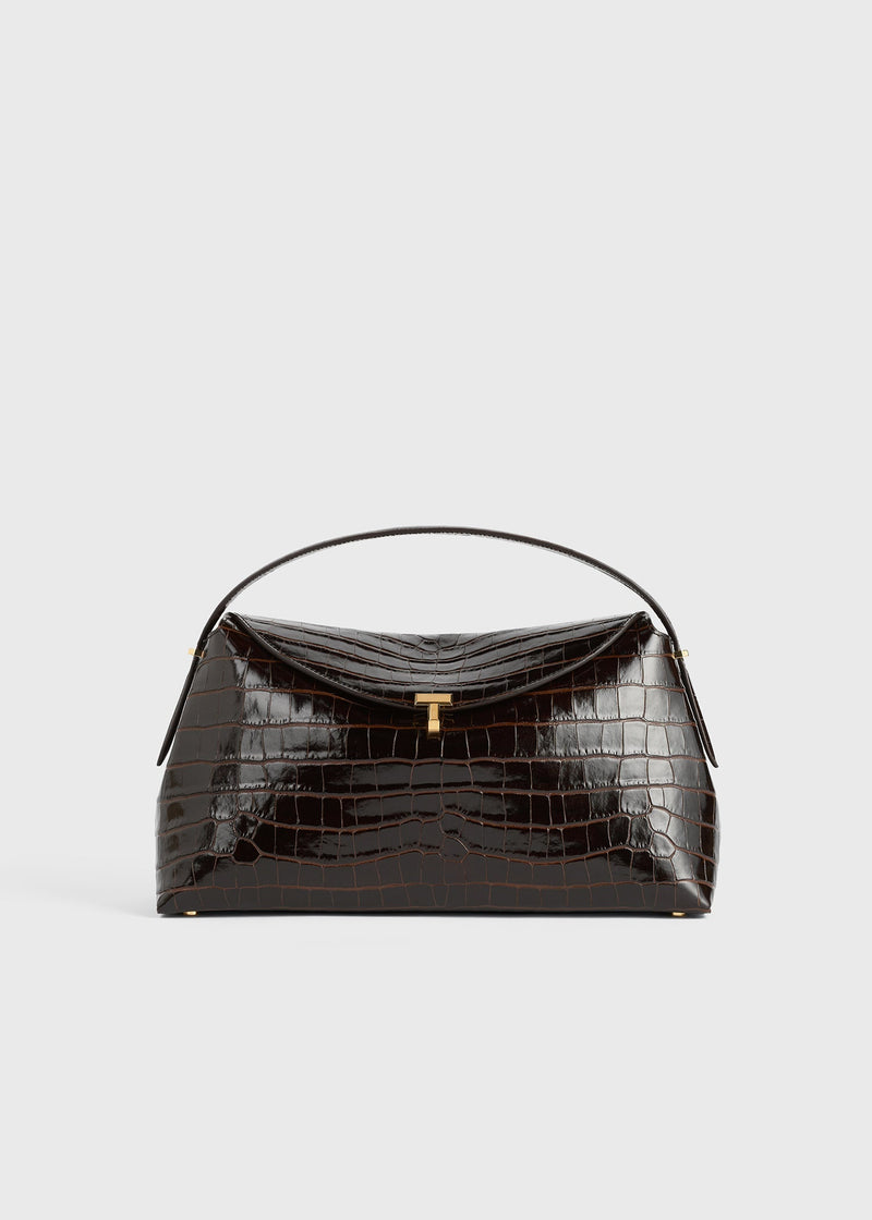 https://cdn.shopify.com/s/files/1/0452/1374/5316/files/TOTEME_PF24_BAGS_243-WAL961-LE0076_T-LOCK_TOP_HANDLE_CROCO_DARK_BROWN_front_GB.jpg?v=1713959708