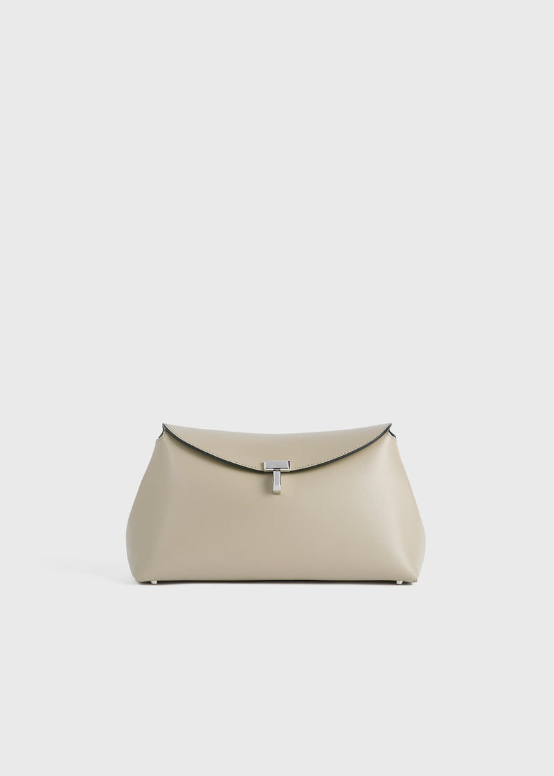 https://cdn.shopify.com/s/files/1/0452/1374/5316/files/TOTEME_SS24_BAGS_234-WAL950-LE0025_T-LOCK_CLUTCH_FAWN_front_GB_cf51cc6d-9615-4bf8-8ede-e130b8a4fe72.jpg?v=1709298457