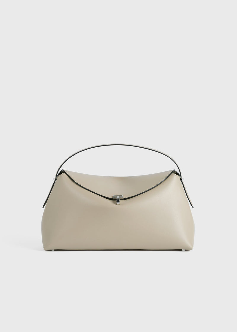 https://cdn.shopify.com/s/files/1/0452/1374/5316/files/TOTEME_SS24_BAGS_234-WAL956-LE0025_T-LOCK_TOP_HANDLE_FAWN_front_GB_1cc314e4-b01c-45e4-9c08-8149a4af9ce2.jpg?v=1709298586