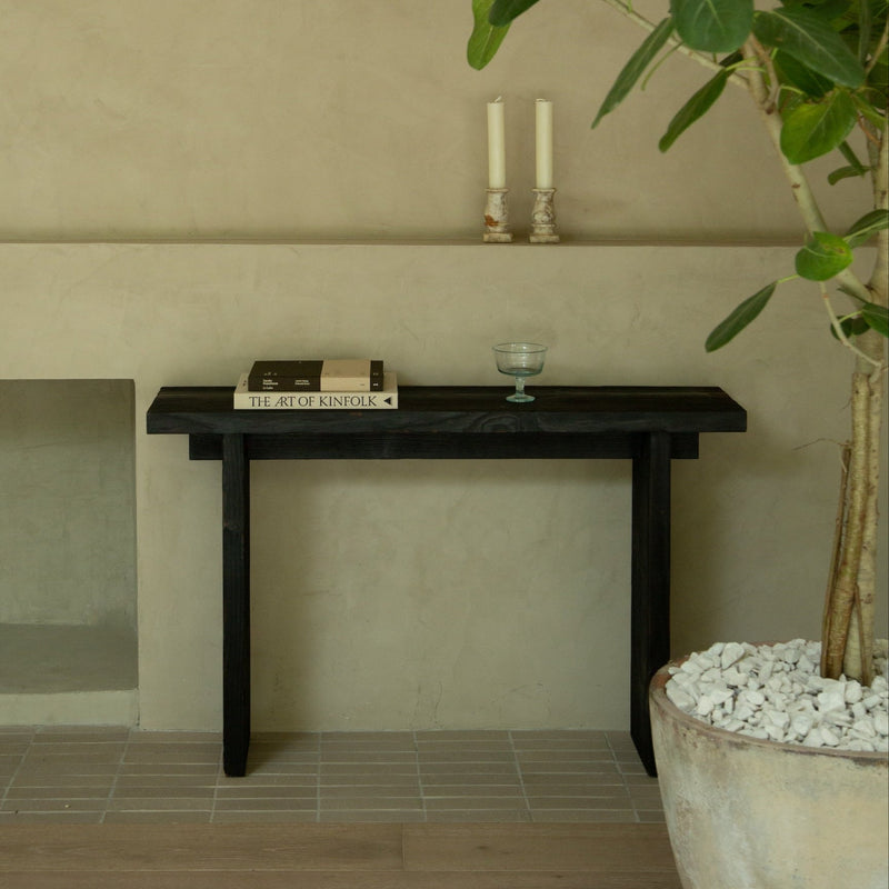 https://cdn.shopify.com/s/files/1/0593/2217/1565/files/black-wood-console-table.jpg?v=1738263116