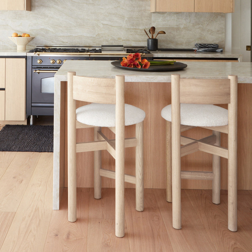 https://cdn.shopify.com/s/files/1/0593/2217/1565/files/boucle-white-oak-counter-stool-updated-color-2025.jpg?v=1765133970