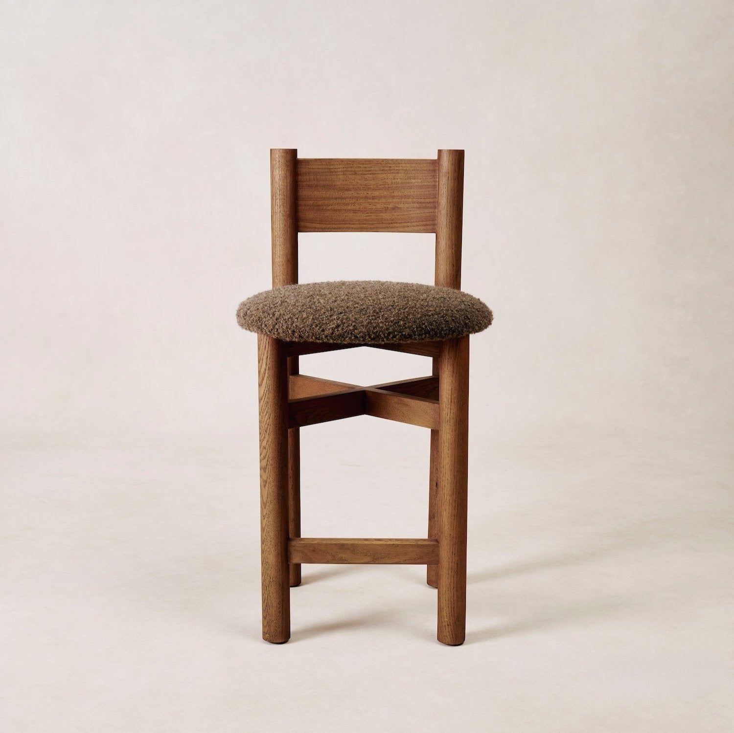 https://cdn.shopify.com/s/files/1/0593/2217/1565/files/brown-counter-stool-boucle.jpg?v=1765301776