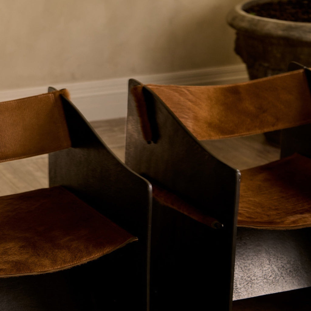 https://cdn.shopify.com/s/files/1/0593/2217/1565/files/brutalist-ingresso-accent-chair-whiskey-hair-on-hide-whiskey-14.jpg?v=1753822707